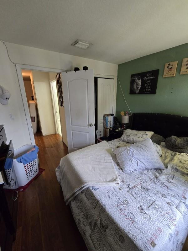 8930 West Flagler Street, Unit 221 Miami, FL 33174 - Photo 12 of 16 a bedroom with a bed and a dresser in it