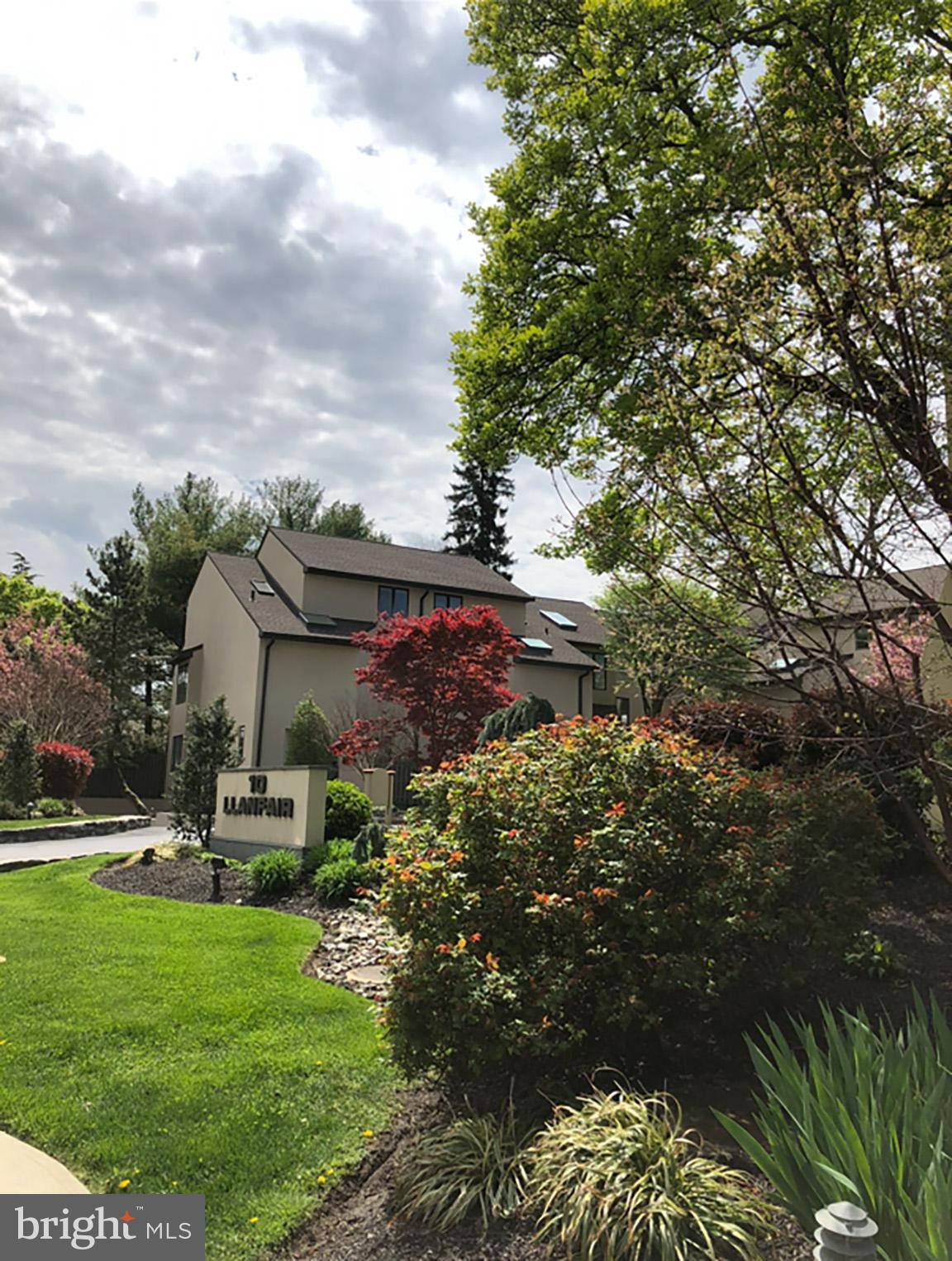 10 Llanfair Road, Unit 9 Ardmore, PA 19003 - Photo 31 of 32 Charming home amidst lush greenery.