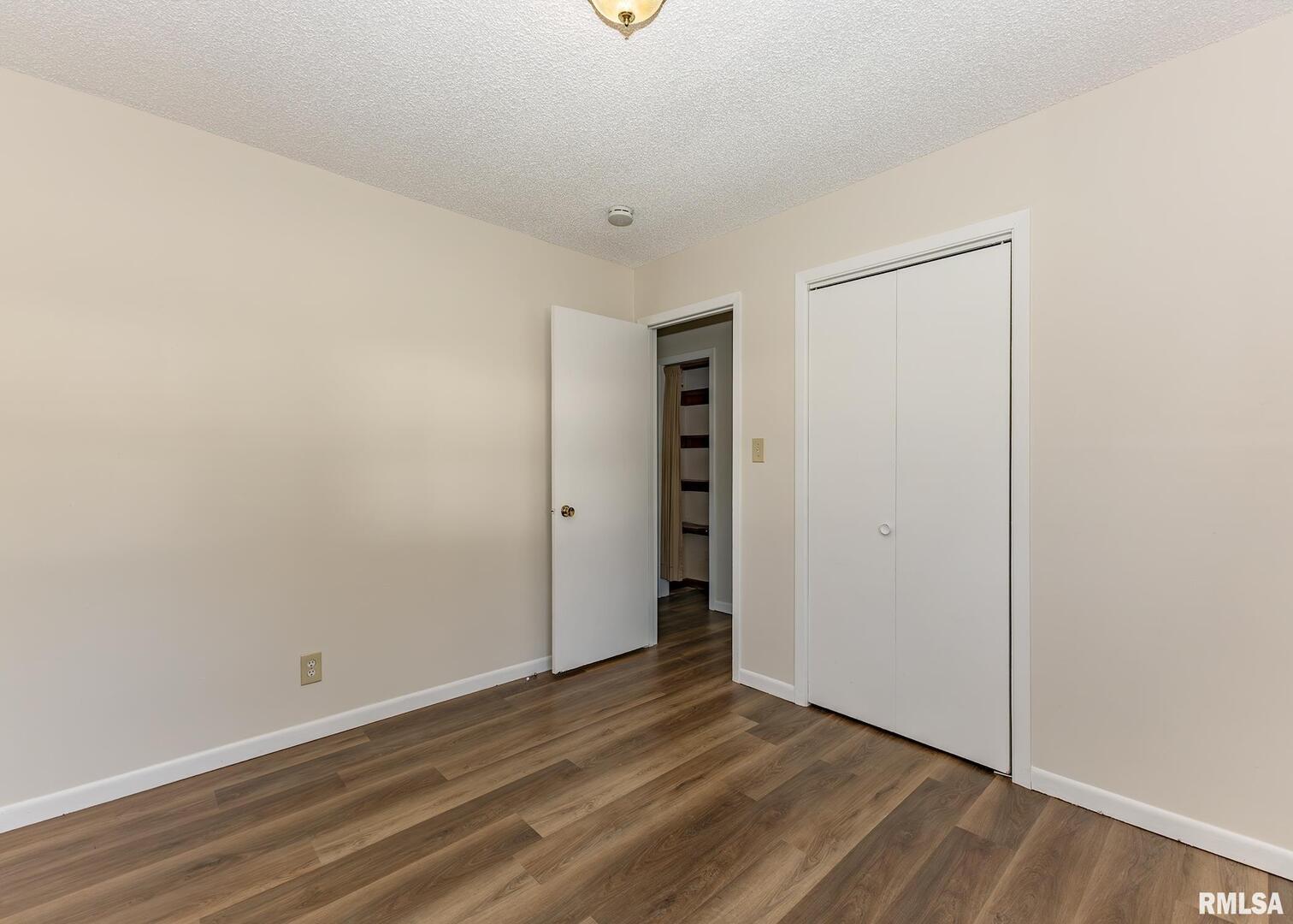 1529 North 8th Street Clinton, IA 52732 - Photo 13 of 15 a view of an empty room with closet and a window