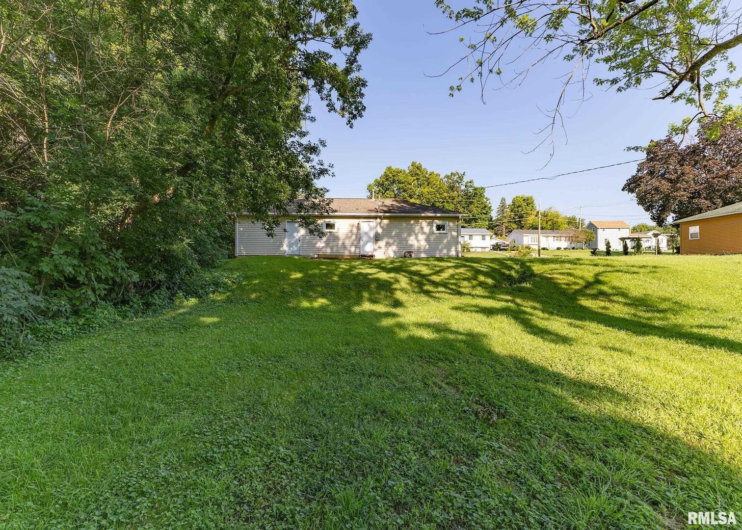 1529 North 8th Street Clinton, IA 52732 - Photo 15 of 15 a view of a big yard with large trees