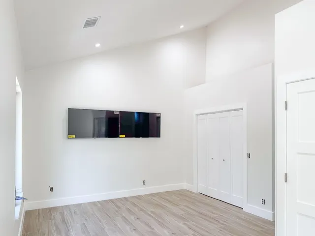 a view of a livingroom with wooden floor