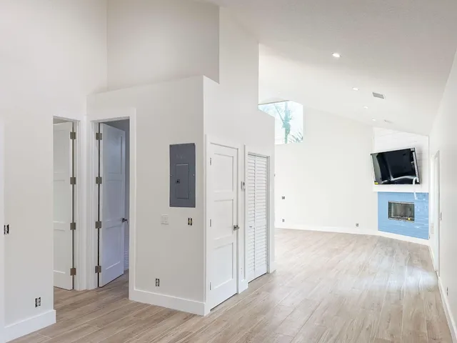 wooden floor in an empty room with a window