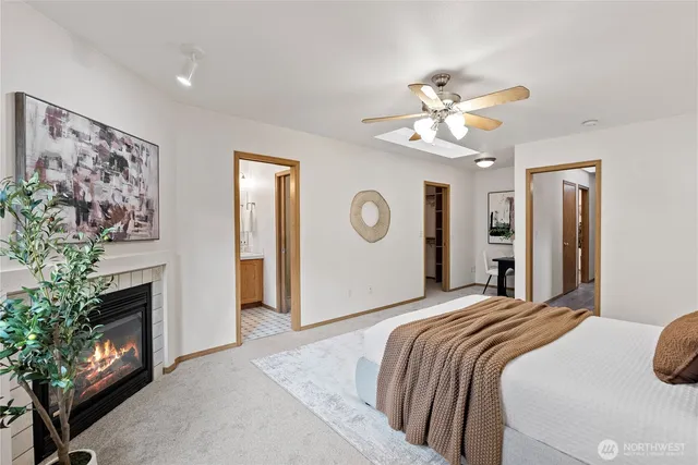 a bedroom with a bed and a fireplace