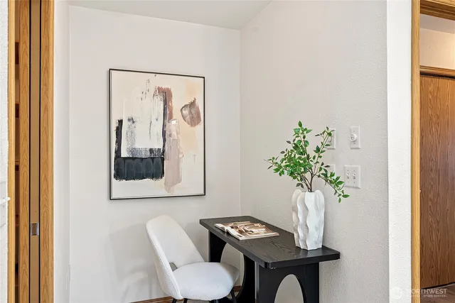 a living room with furniture and a potted plant