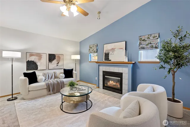 a living room with furniture and a fireplace