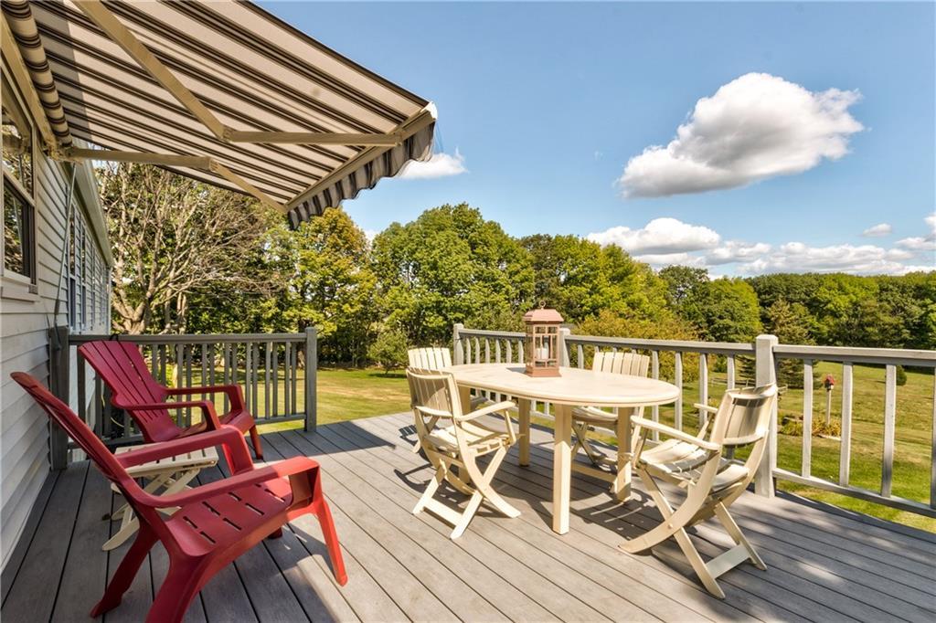 737 Pond Road Sidney, ME 04330 - Photo 22 of 34 Back Deck with a peaceful pastoral view.