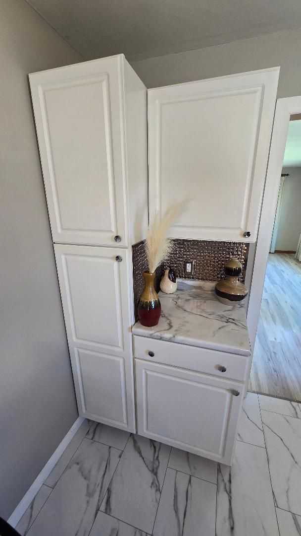 1124 13th Avenue Fulton, IL 61252 - Photo 13 of 27 a bathroom with a sink a mirror and shower