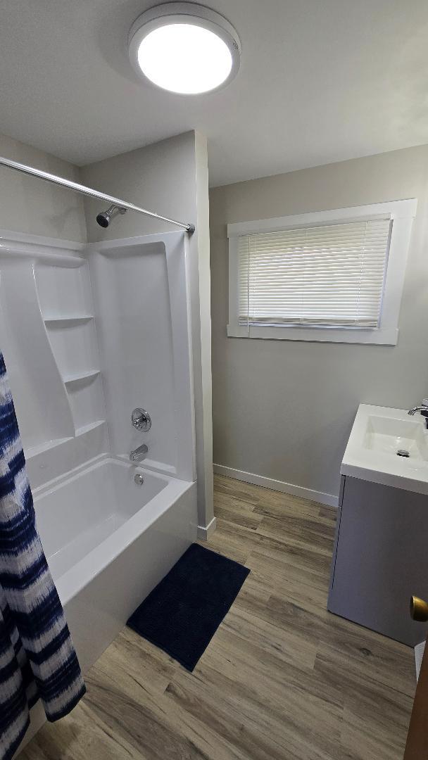 1124 13th Avenue Fulton, IL 61252 - Photo 14 of 27 a bathroom with a tub sink and mirror