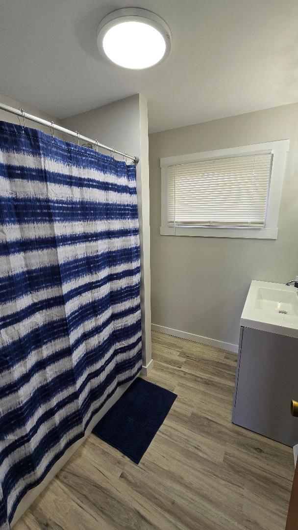 1124 13th Avenue Fulton, IL 61252 - Photo 16 of 27 a view of empty room with wooden floor and fan