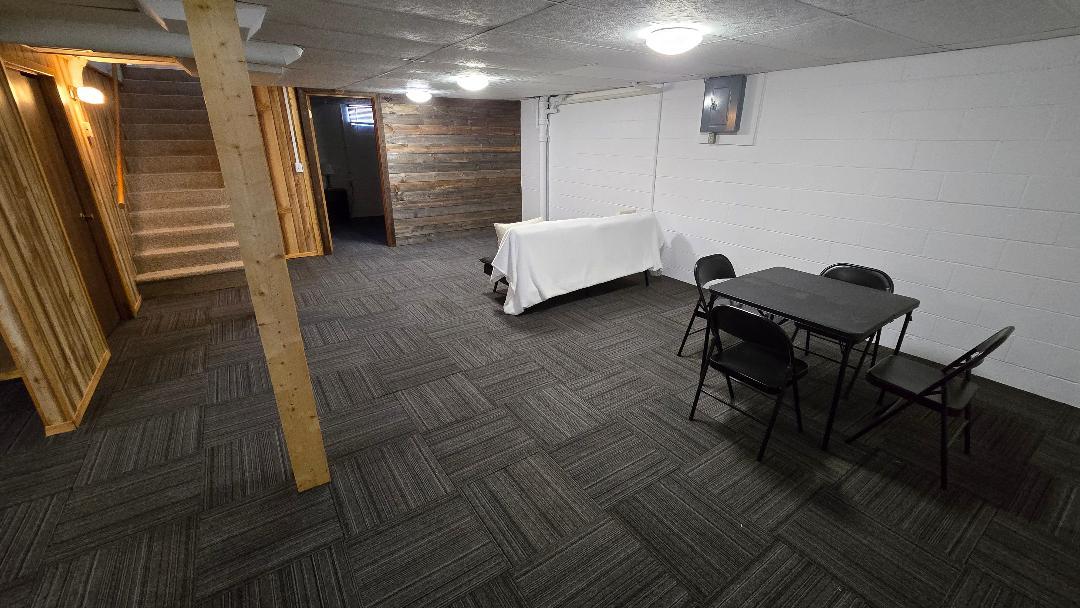 1124 13th Avenue Fulton, IL 61252 - Photo 24 of 27 a hallway with chairs and a rug