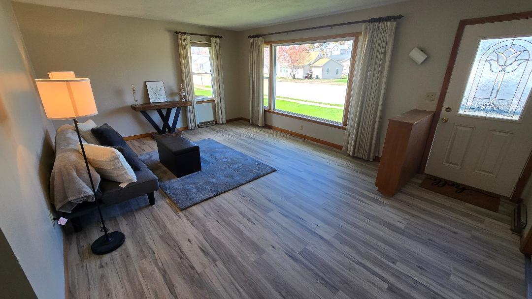 1124 13th Avenue Fulton, IL 61252 - Photo 6 of 27 a living room with furniture and a window
