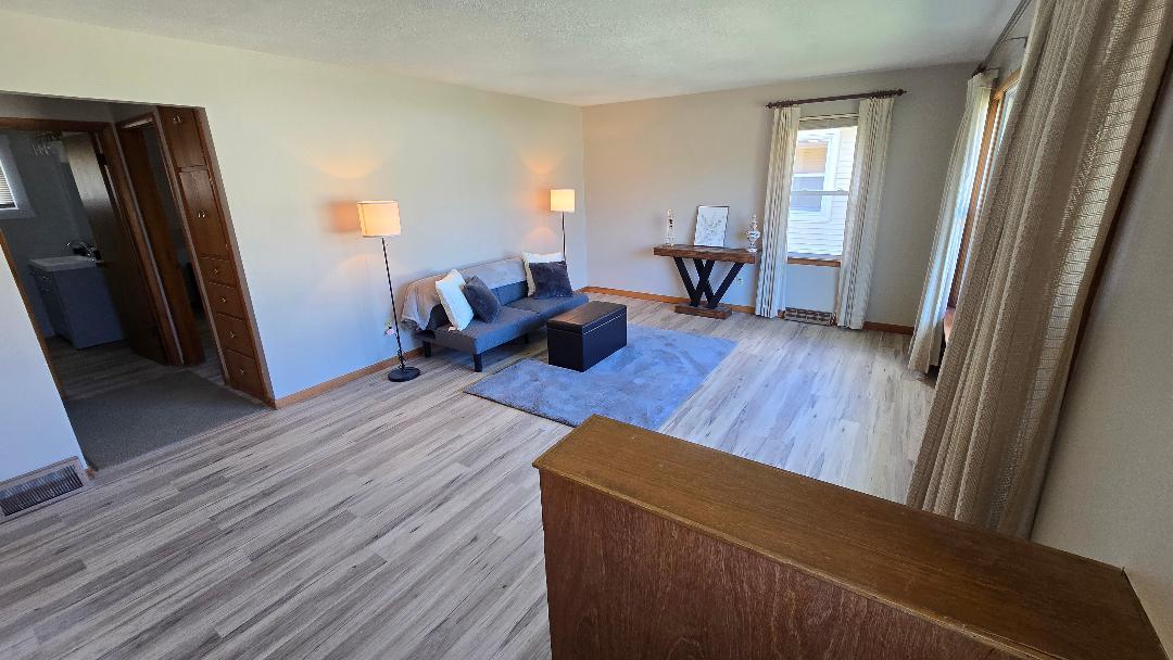 1124 13th Avenue Fulton, IL 61252 - Photo 10 of 27 a living room with furniture and a wooden floor