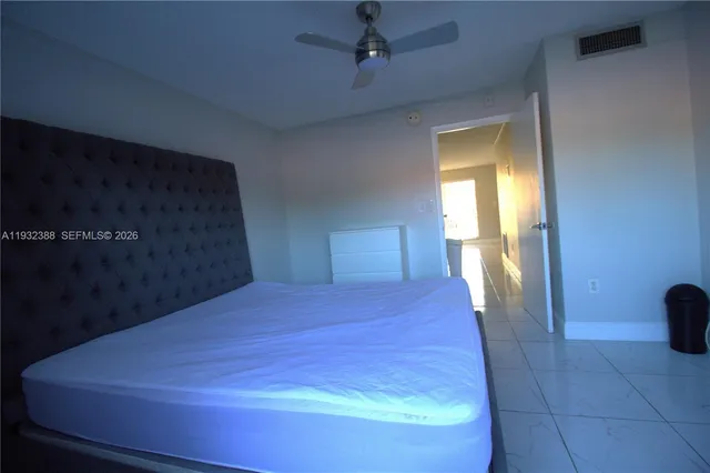 a room with a bed and a shower