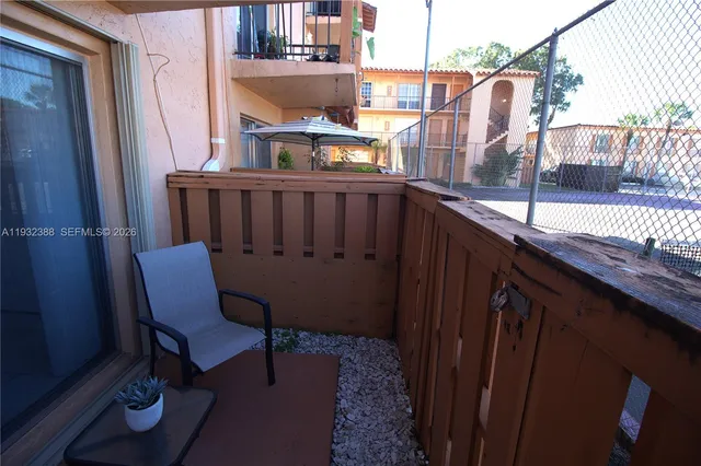 a view of a balcony with chairs