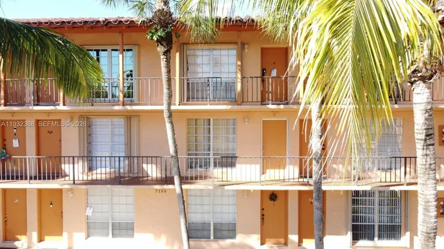 a view of a large building with a tree