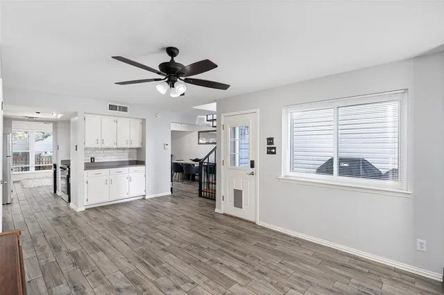 a view of kitchen with furniture and a ceiling fan