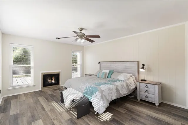 a bedroom with a bed and a fireplace