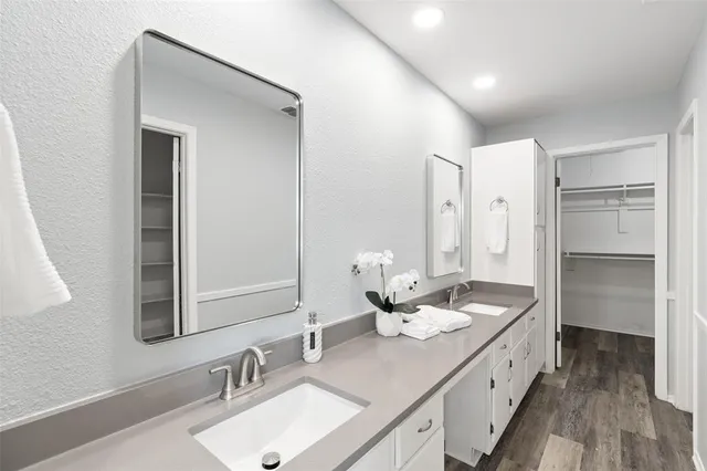 a bathroom with a double vanity sink mirror and double