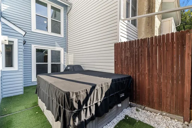 a balcony view with a backyard space