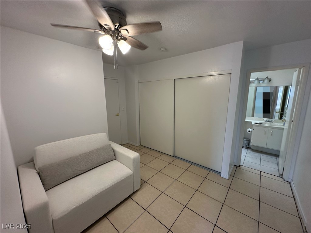 3936 Rive Gauche Street Las Vegas, NV 89115 - Photo 18 of 30 Sitting room with ceiling fan and light tile patterned floors