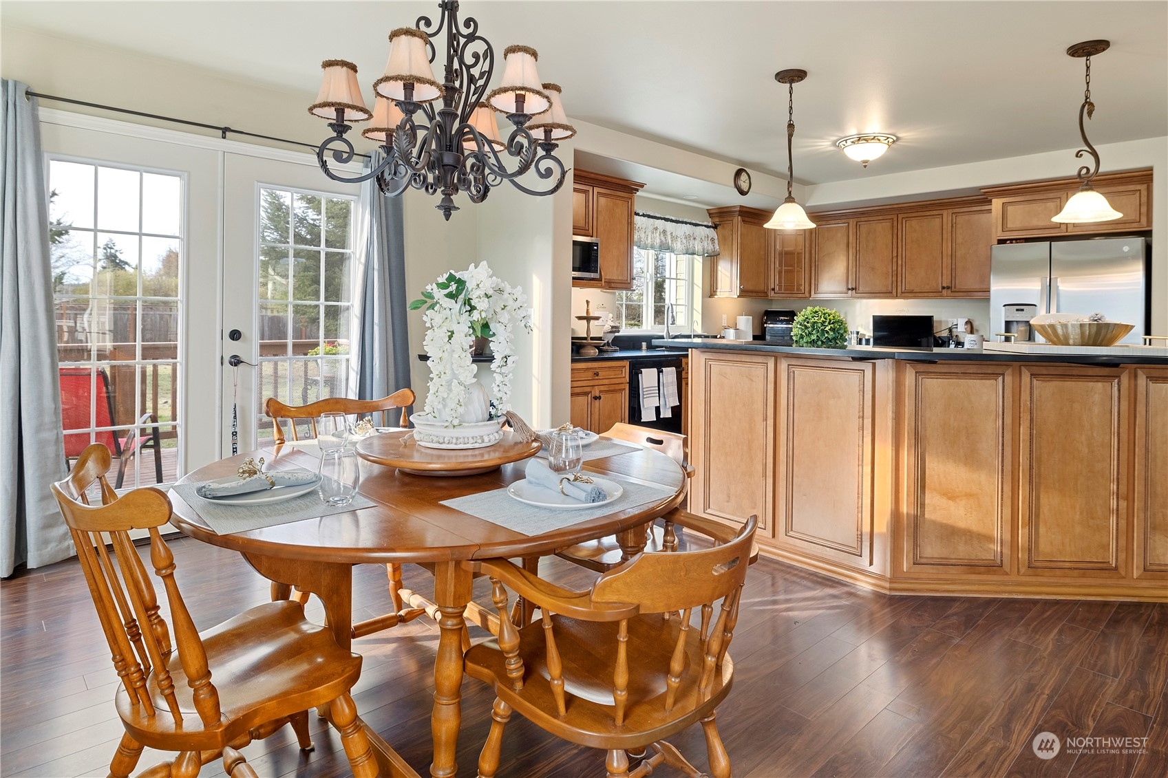 261 Chiesa Place Sequim, WA 98382 - Photo 14 of 39 a view of a dining room with furniture window and wooden floor