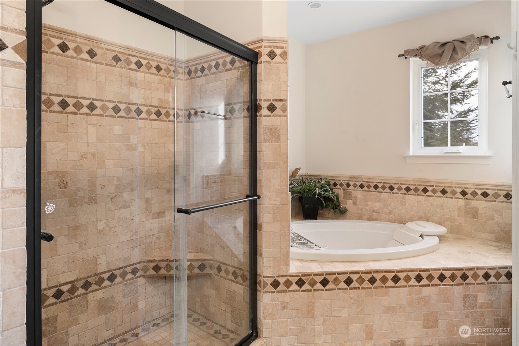 261 Chiesa Place Sequim, WA 98382 - Photo 17 of 39 a bathroom with a bath tub and a shower