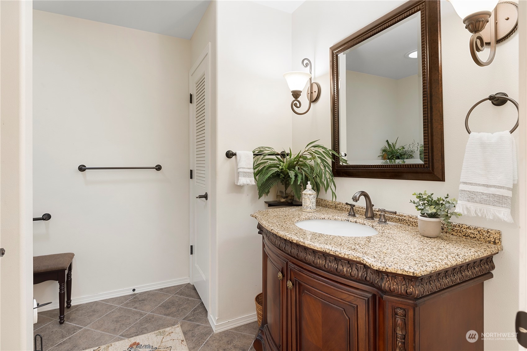 261 Chiesa Place Sequim, WA 98382 - Photo 21 of 39 a bathroom with a granite countertop sink and a mirror