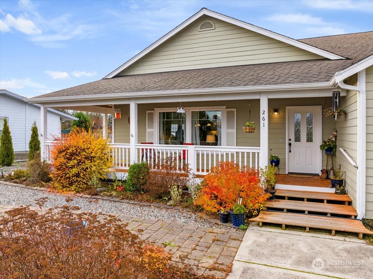 261 Chiesa Place Sequim, WA 98382 - Photo 24 of 39 a front view of a house with a garden