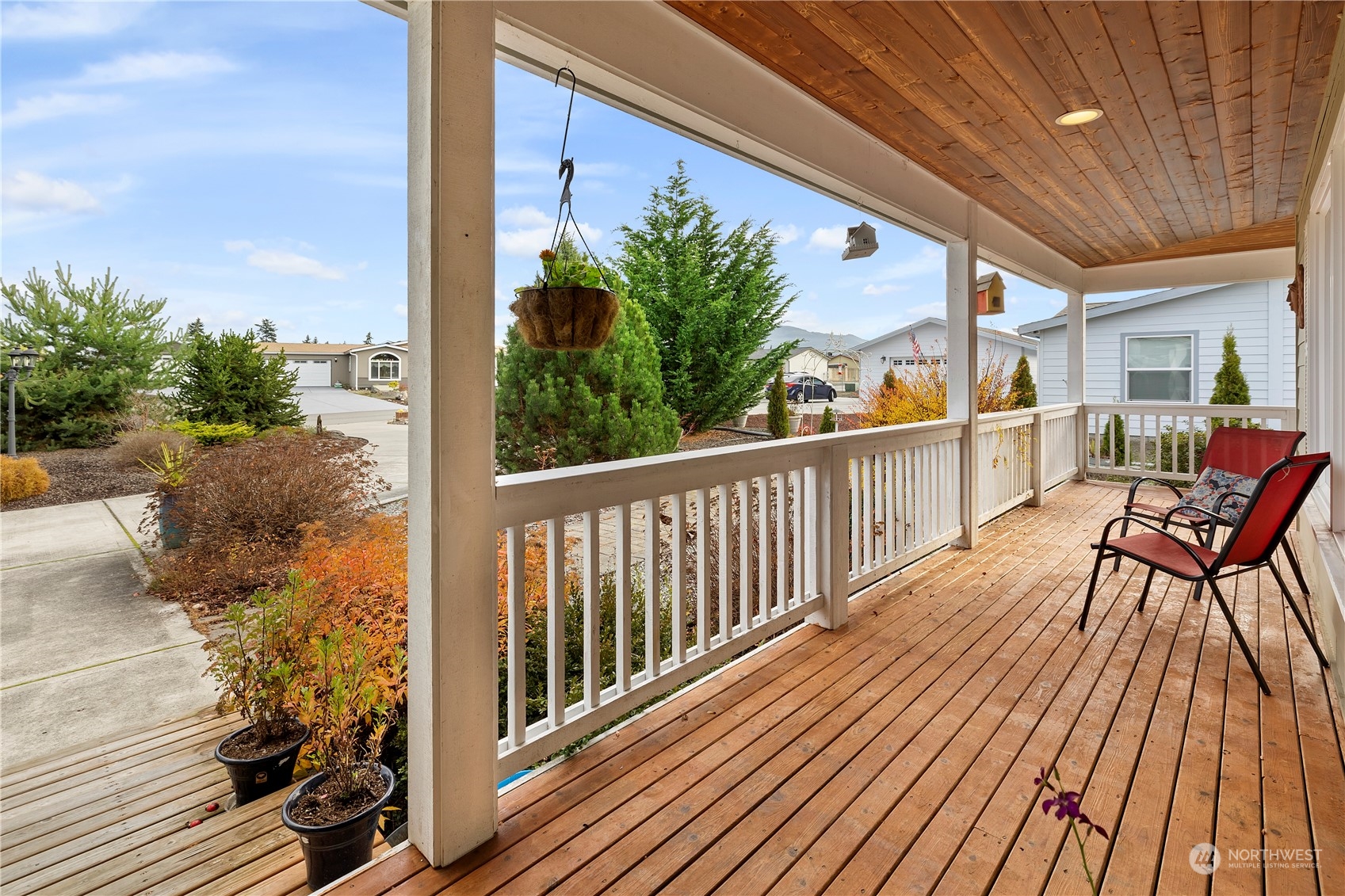 261 Chiesa Place Sequim, WA 98382 - Photo 25 of 39 a view of a balcony with chairs and wooden floor