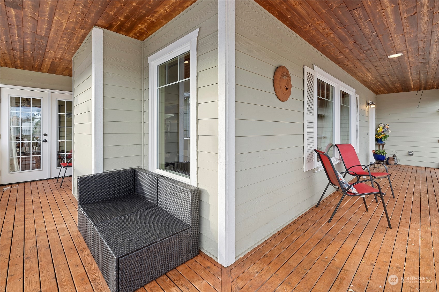 261 Chiesa Place Sequim, WA 98382 - Photo 26 of 39 a balcony with furniture and wooden floor
