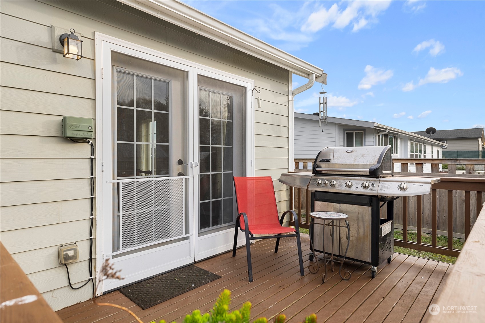 261 Chiesa Place Sequim, WA 98382 - Photo 30 of 39 a backyard of a house with table and chairs