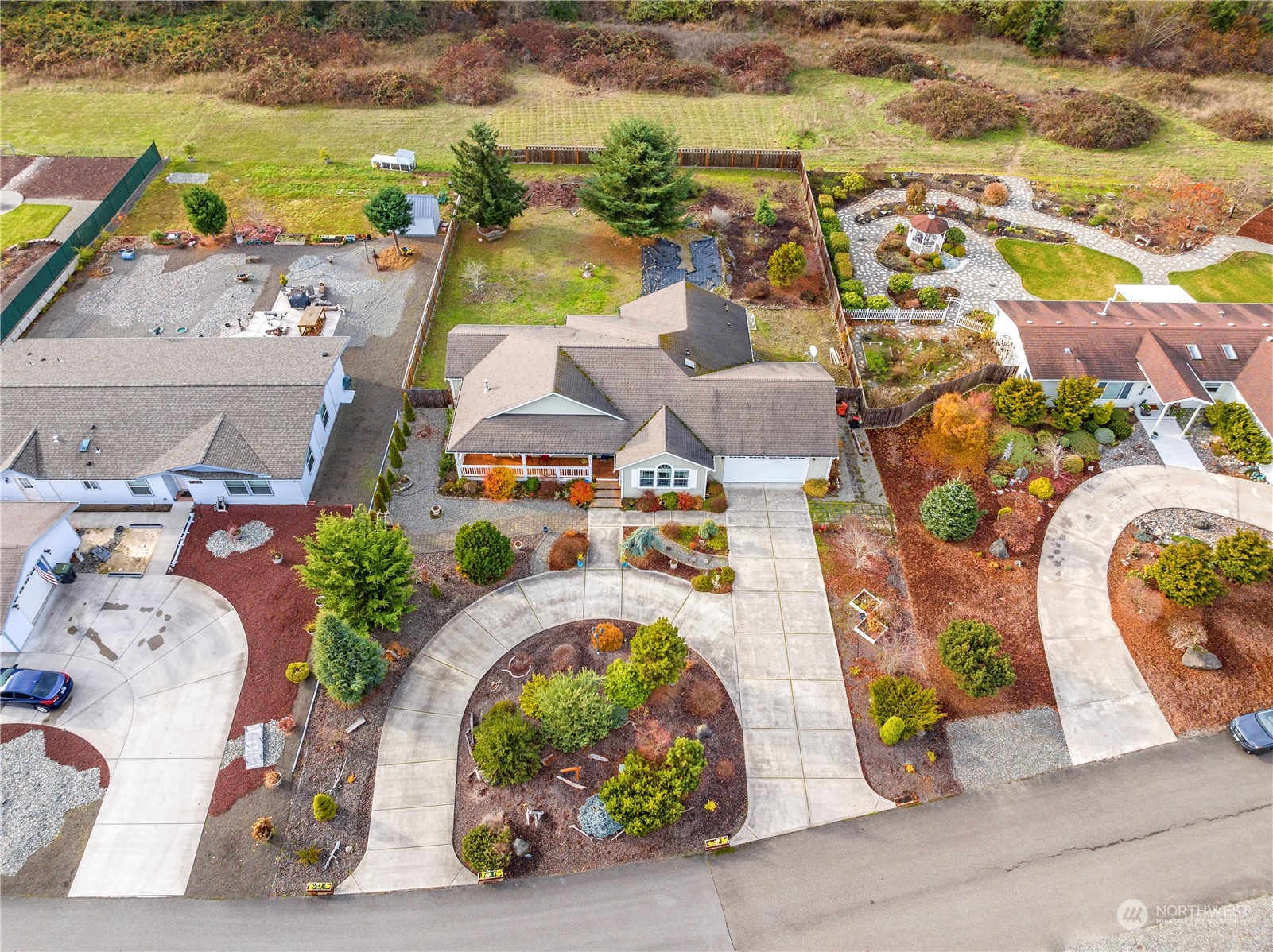 261 Chiesa Place Sequim, WA 98382 - Photo 33 of 39 an aerial view of a house with a swimming pool and outdoor seating