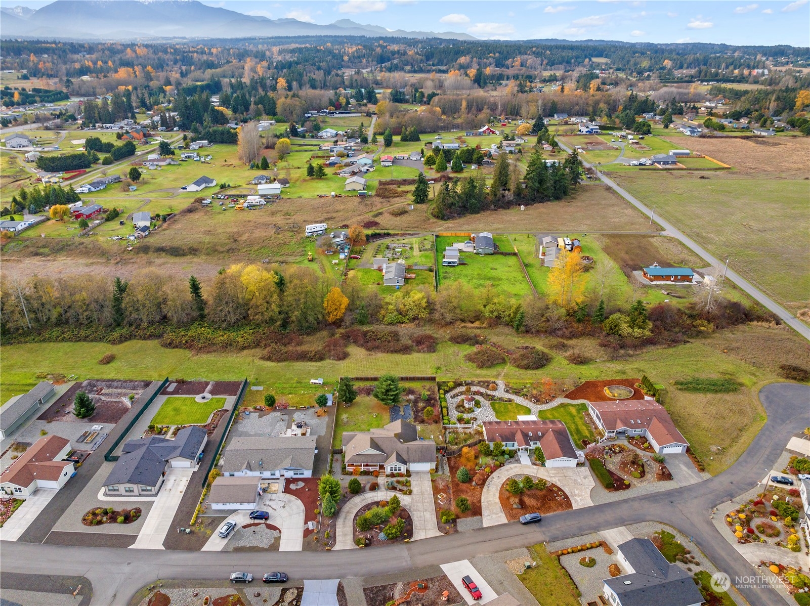 261 Chiesa Place Sequim, WA 98382 - Photo 35 of 39 an aerial view of residential houses with outdoor space