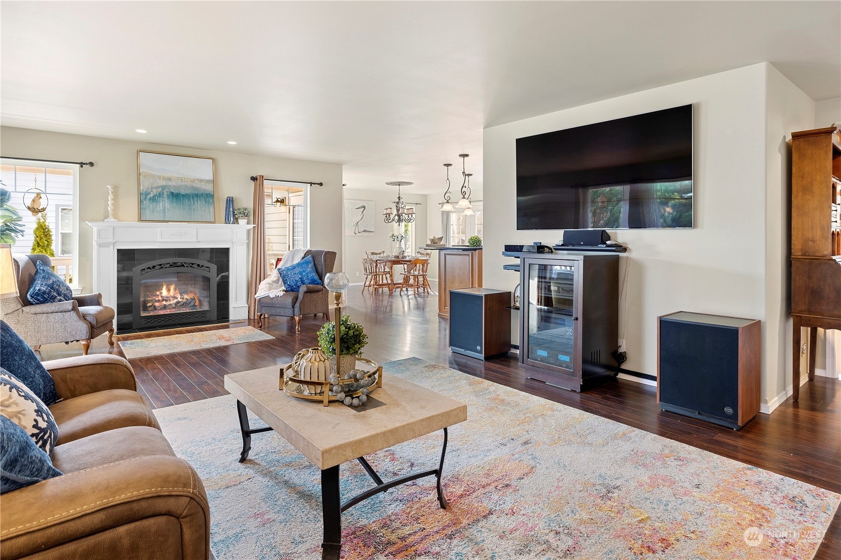 261 Chiesa Place Sequim, WA 98382 - Photo 5 of 39 a living room with furniture a flat screen tv and a fireplace