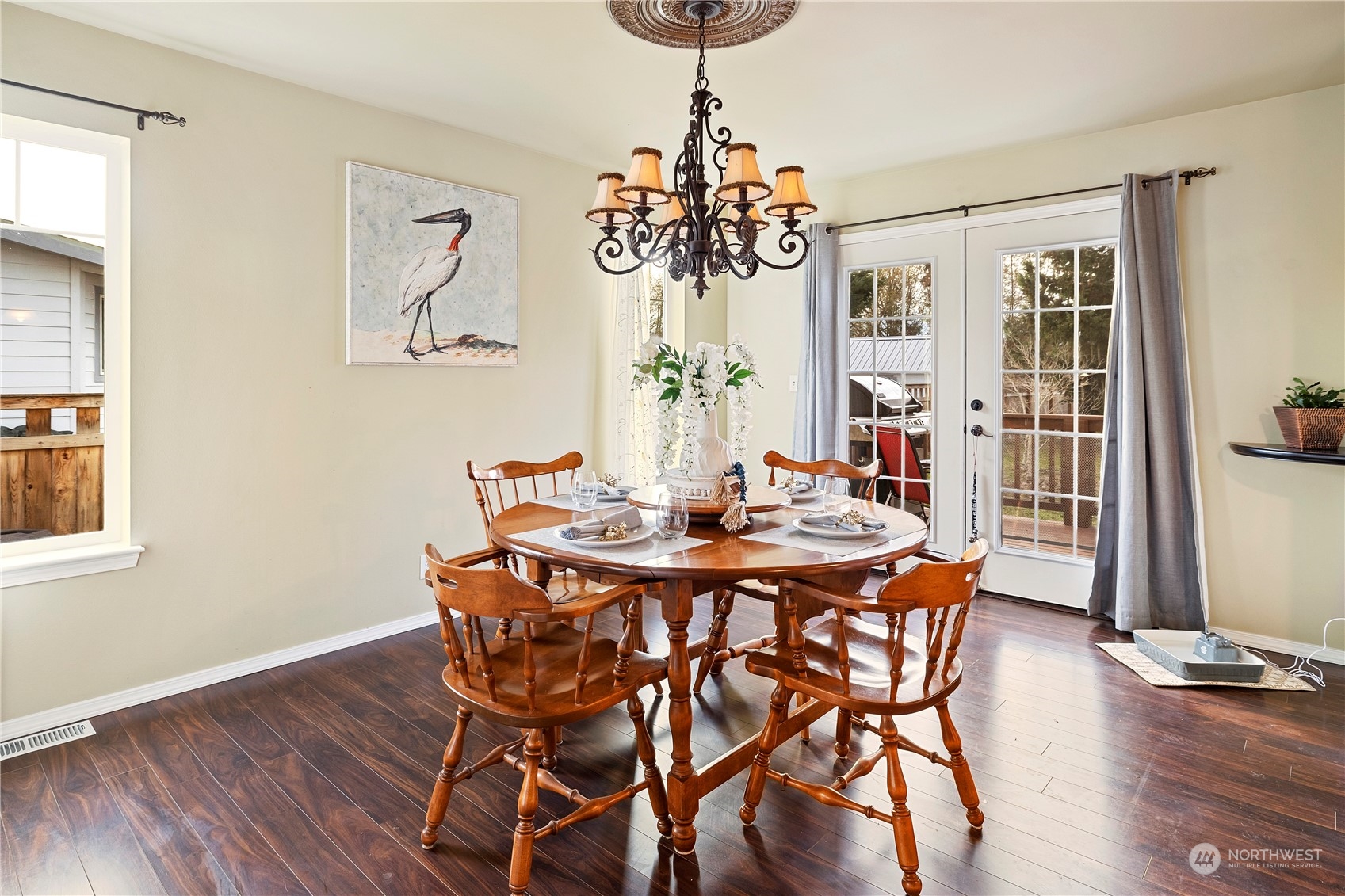 261 Chiesa Place Sequim, WA 98382 - Photo 9 of 39 a view of a dining room with furniture window and wooden floor