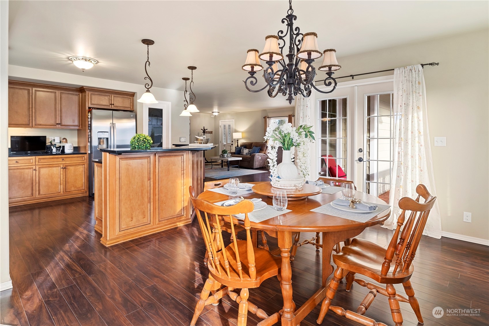 261 Chiesa Place Sequim, WA 98382 - Photo 10 of 39 a view of a dining room with furniture window and wooden floor