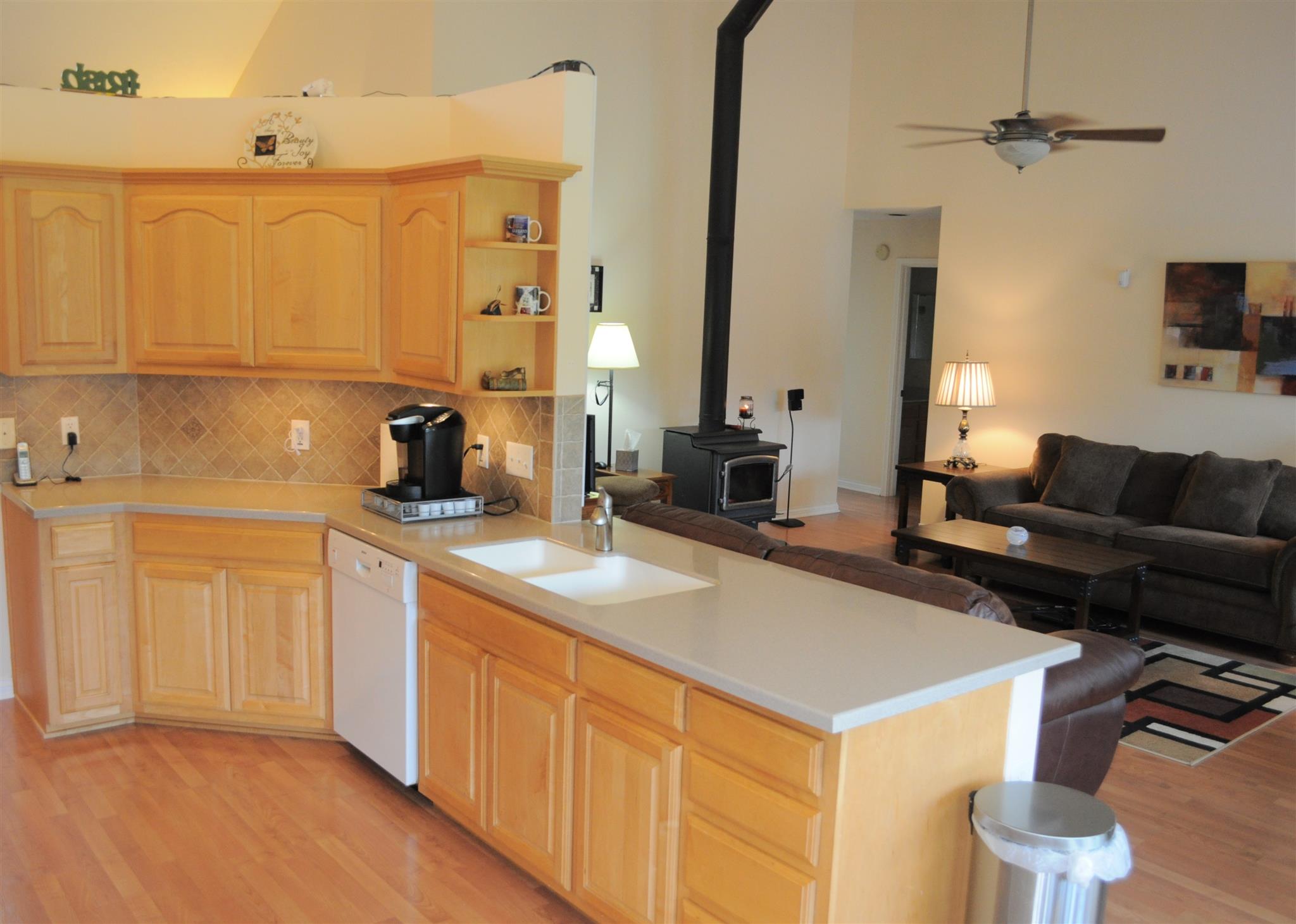 358 Hollis Chapel Road Portland, TN 37148 - Photo 3 of 30 a kitchen with a sink refrigerator and cabinets