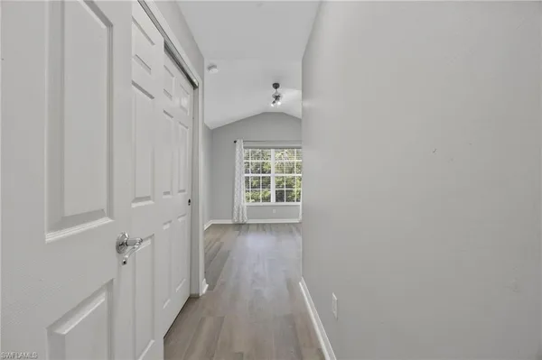 a view of hallway with closet