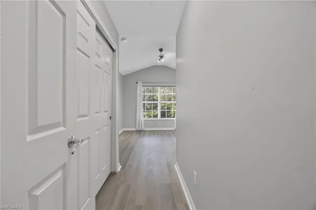 a view of hallway with closet
