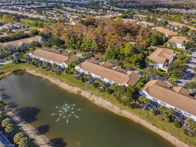 an aerial view of residential building and lake view