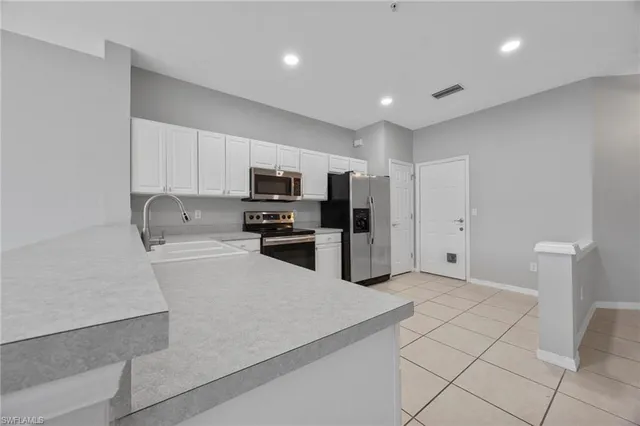 a view of a kitchen with furniture and a kitchen