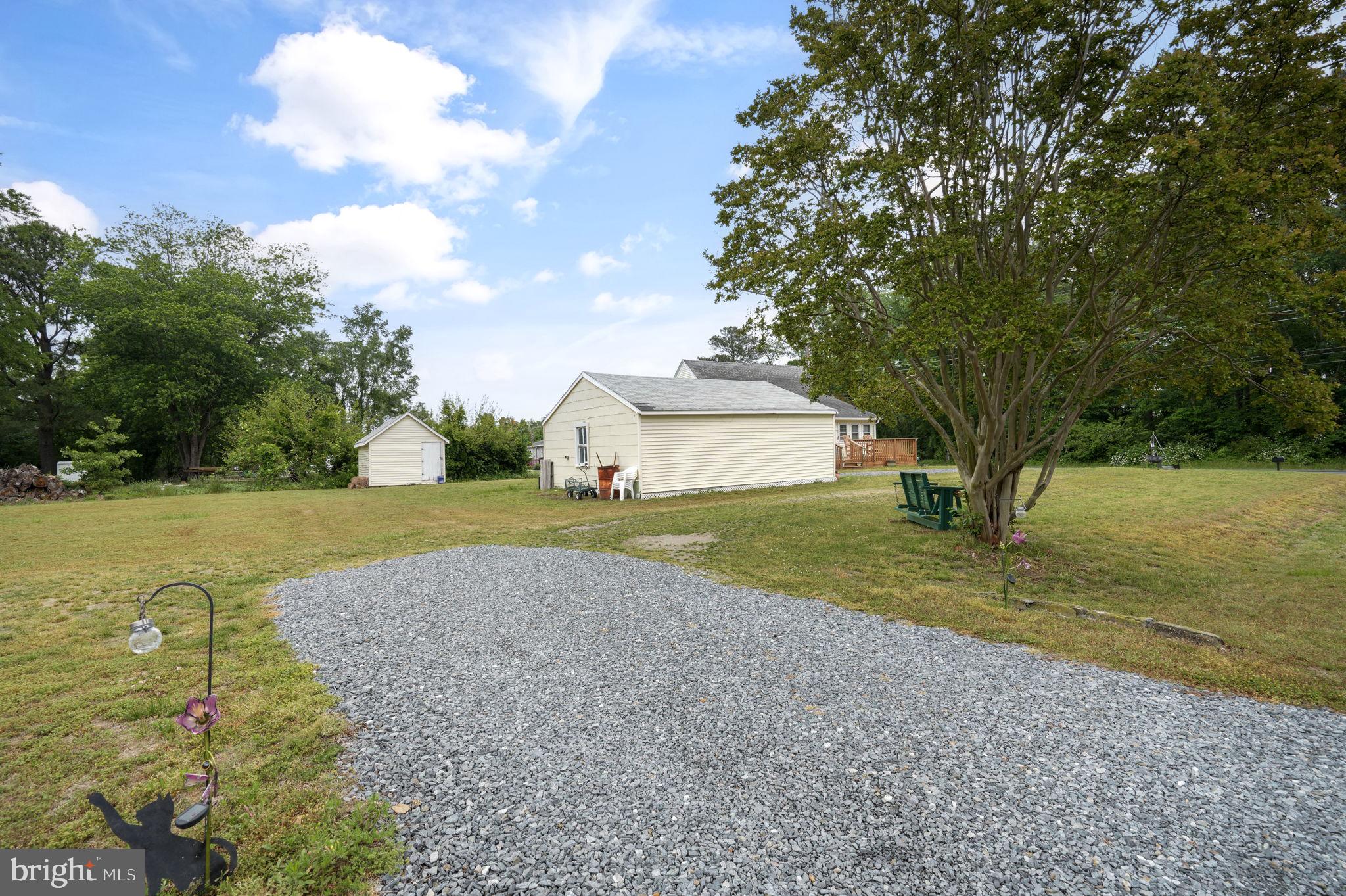 7278 Fleming Road New Church, VA 23415 - Photo 35 of 44 a view of a house with backyard and tree s