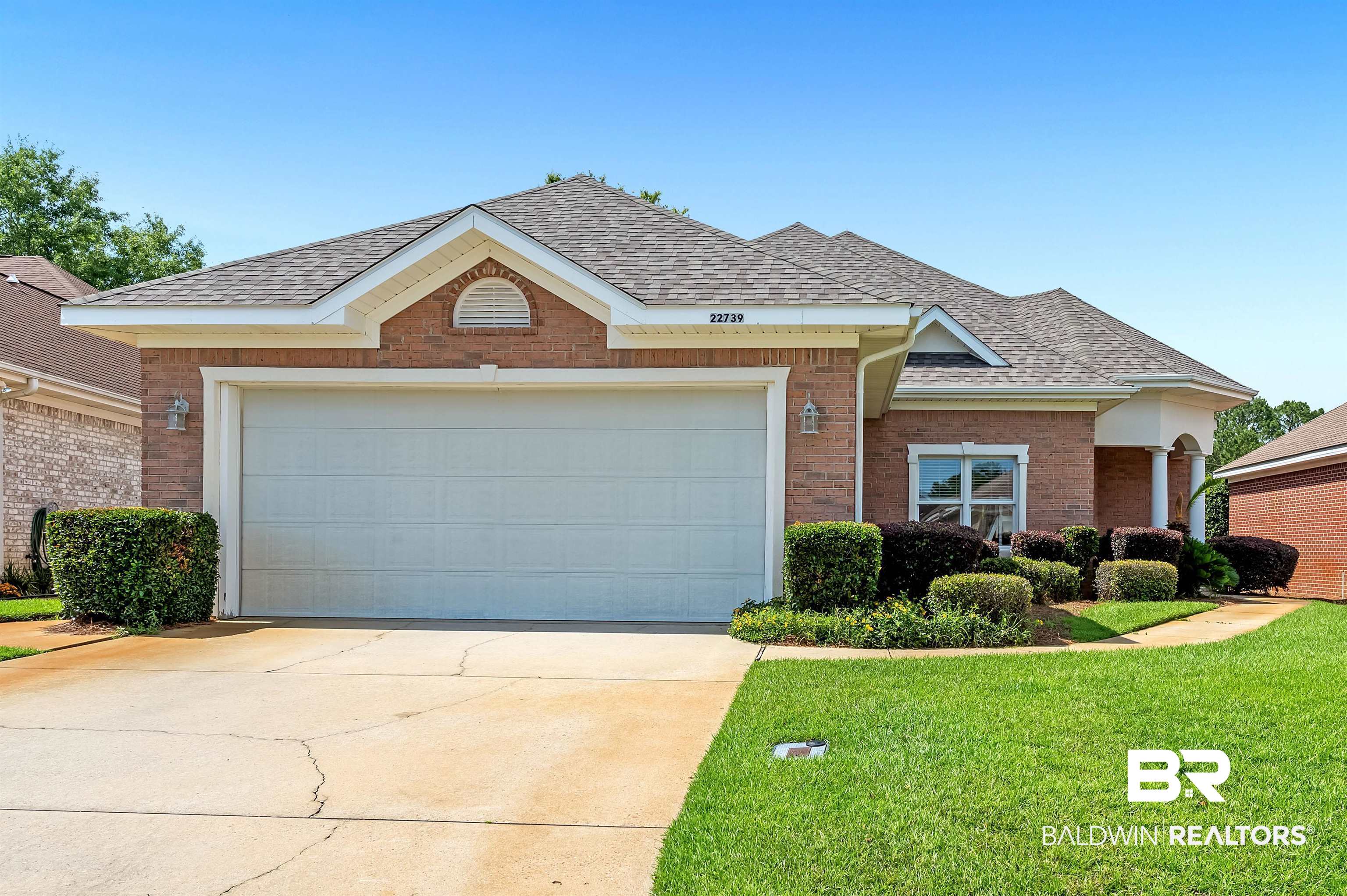 22739 Inverness Way Foley, AL 36535 - Photo 7 of 80 View of front of home with brick siding, roof with shingles, and driveway