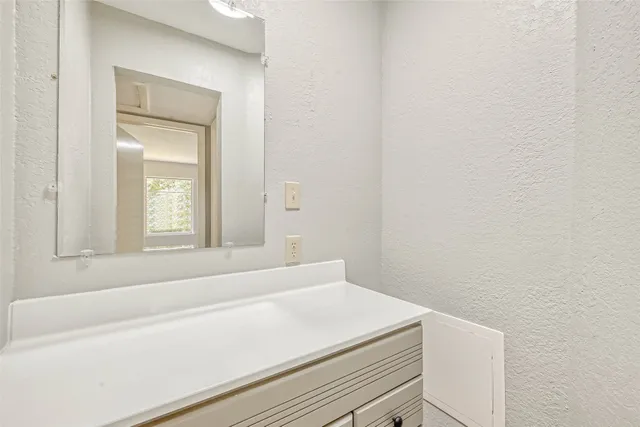 a bathroom with a bathtub and a window