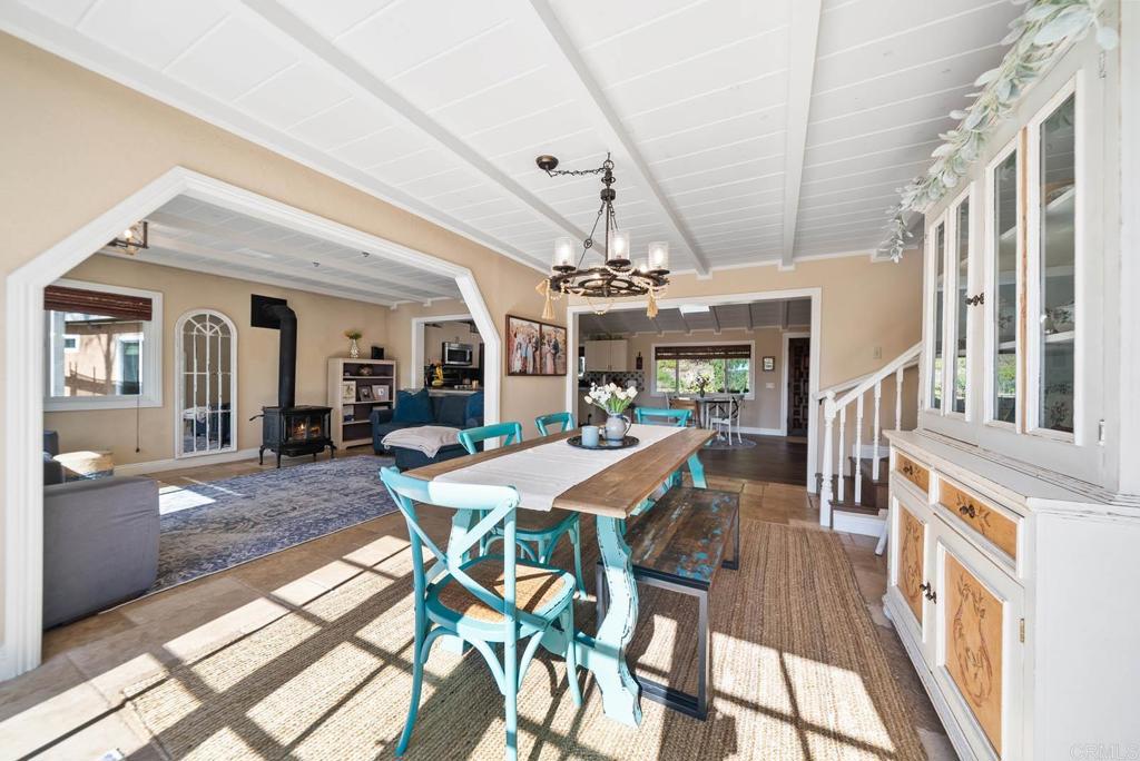 1569 Vía Monserate Fallbrook, CA 92028 - Photo 19 of 75 a view of a dining room with furniture window and wooden floor