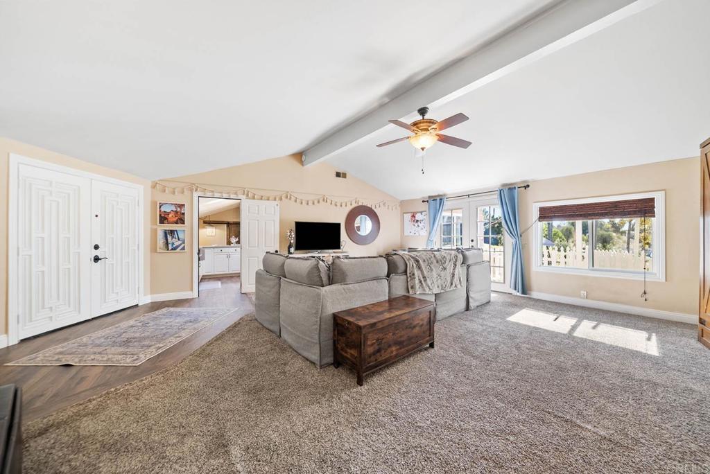 1569 Vía Monserate Fallbrook, CA 92028 - Photo 21 of 75 a living room with furniture and a large window