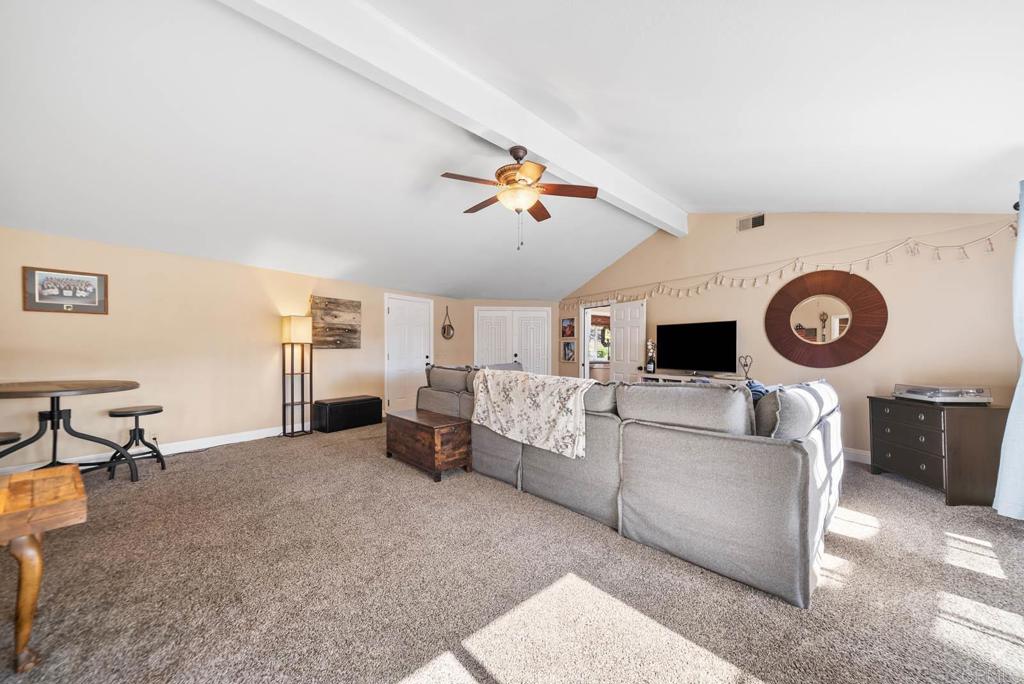 1569 Vía Monserate Fallbrook, CA 92028 - Photo 22 of 75 a living room with furniture and a flat screen tv