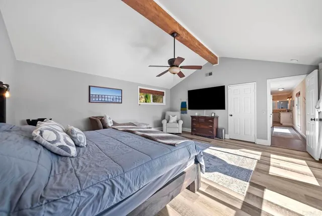 a bed room with a bed and dresser