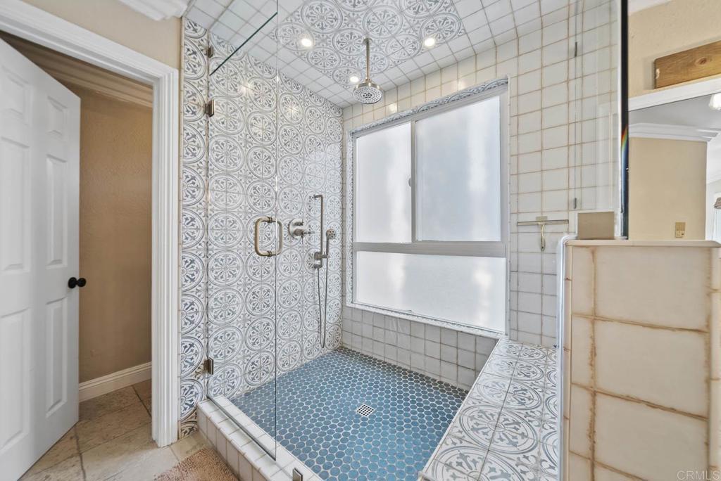 1569 Vía Monserate Fallbrook, CA 92028 - Photo 27 of 75 a bathroom with a glass shower door