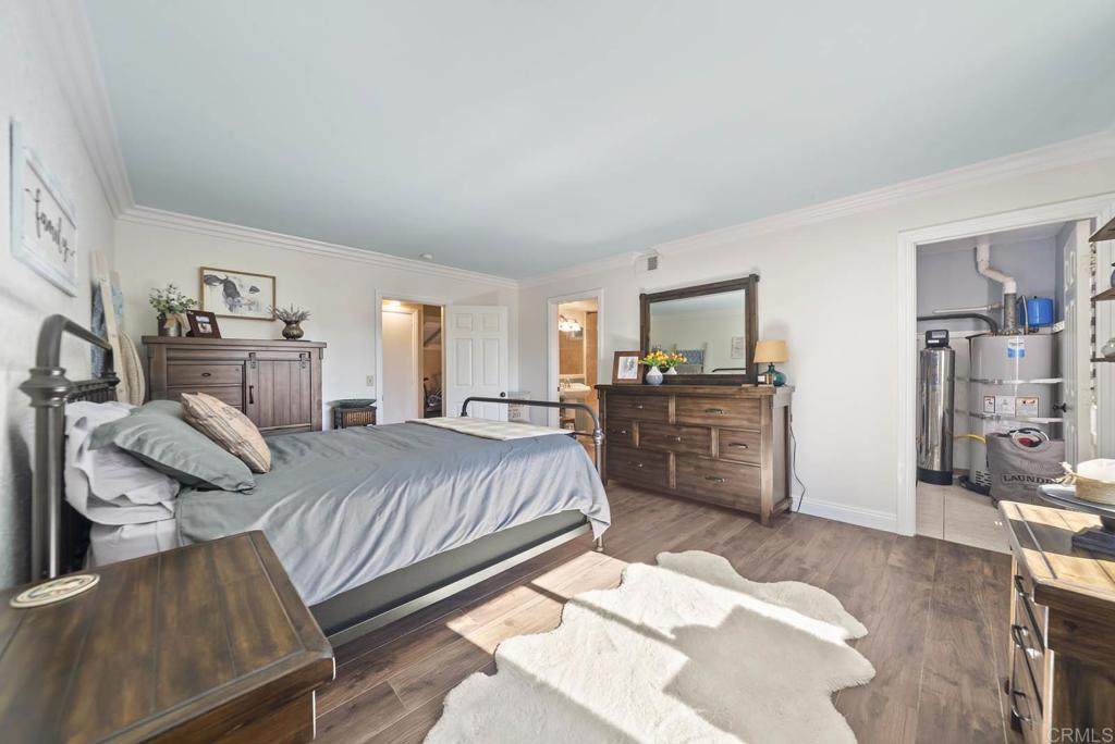 1569 Vía Monserate Fallbrook, CA 92028 - Photo 30 of 75 a bed room with a bed and dresser